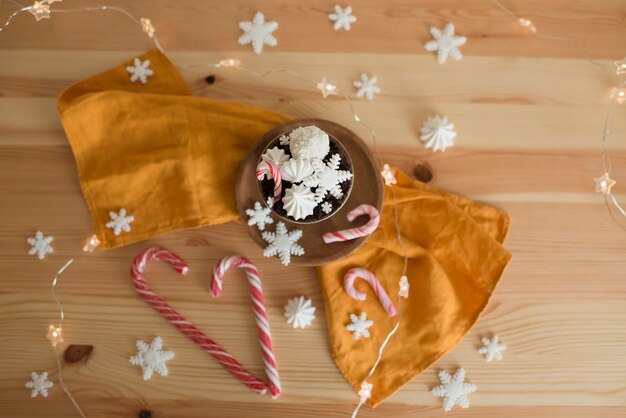 Christmas pastries in a cup on a wooden table