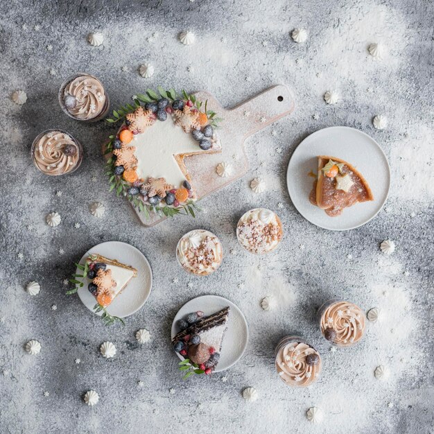 Christmas pastries decorated with berries on the table