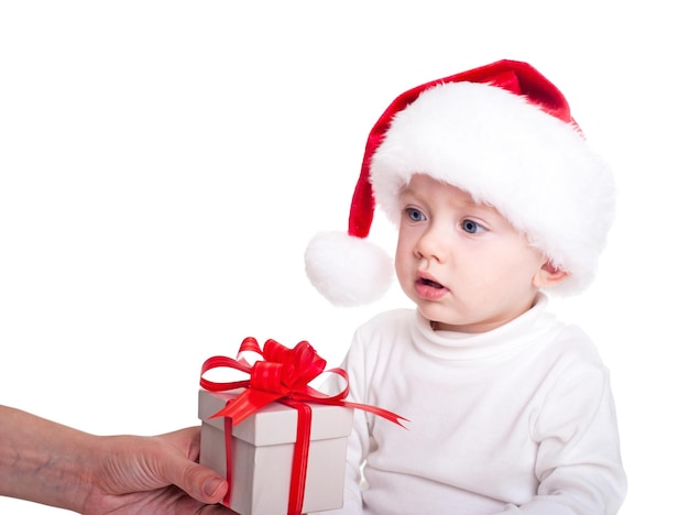 Christmas photo Baby with gift isolated on white background