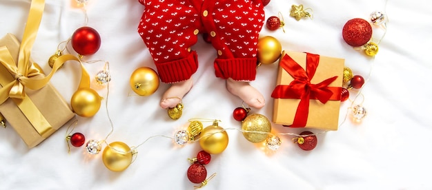 Christmas photo of baby with New Year's decor. selective focus. holiday.