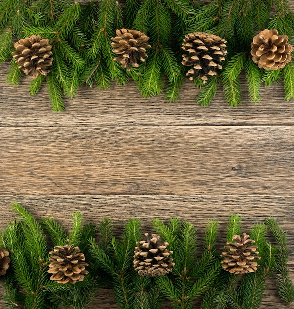 Christmas pine branches on a wooden table