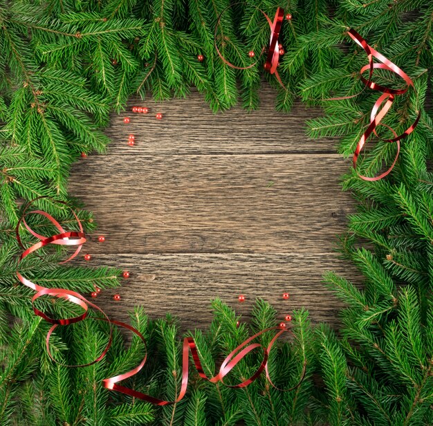 Christmas pine branches on a wooden table