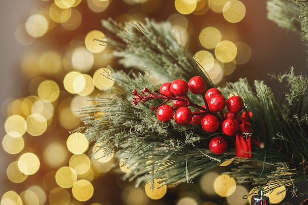 Christmas pine tree branch with decorations close up