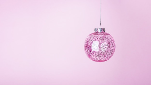 Christmas pink bauble, shiny ball hanging.