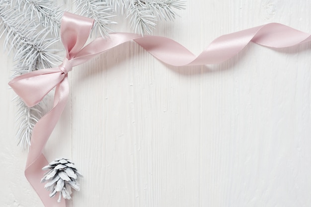 Christmas pink ribbon frame with tree cone, flatlay 