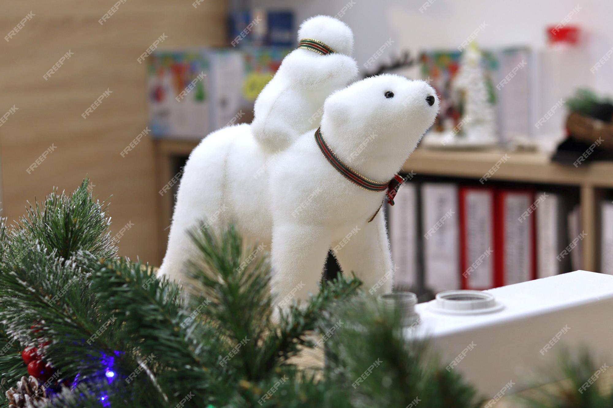 Premium Photo | Christmas polar bear on the background of fir ...