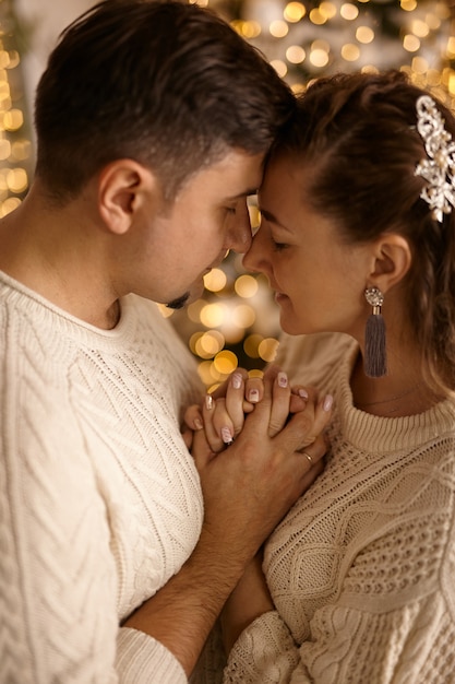 Christmas portrait close up romantic sensual couple in love kissing