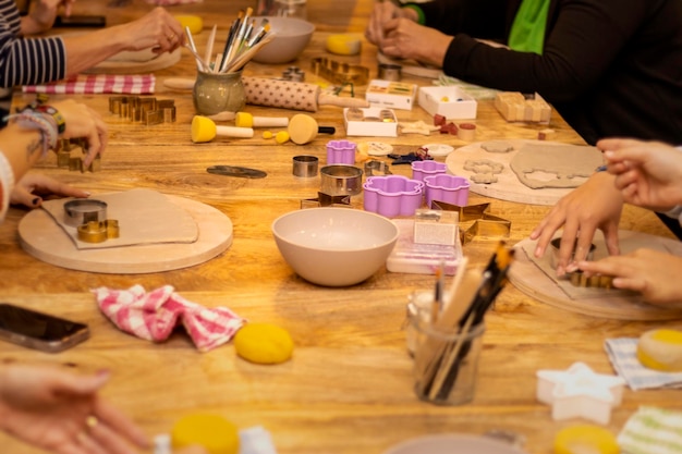 Christmas pottery workshop People working the pottery to make ornaments