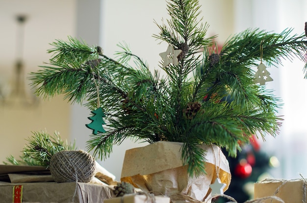 Christmas preparation and composition  Coniferous branches with ornaments made of natural materials