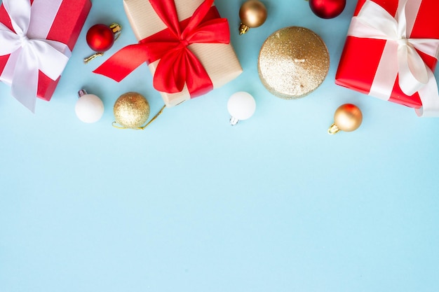 Christmas present boxes on blue background Top view with copy space