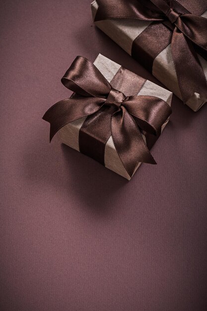 Christmas presents on brown background holidays concept