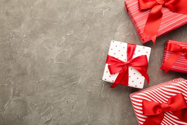 Christmas presents and decoration on grey background.