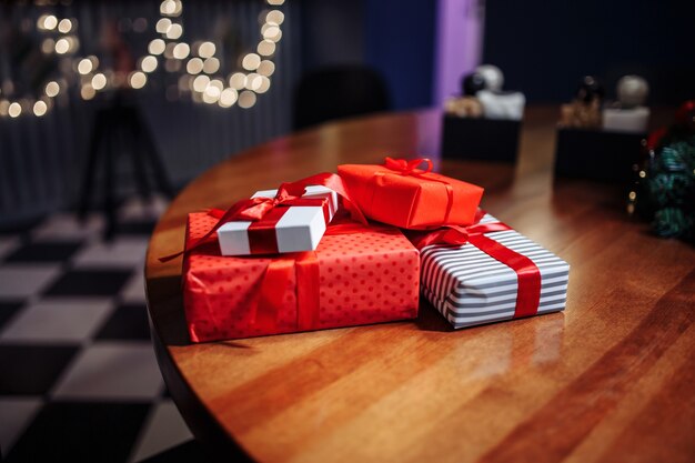 Photo christmas presents. a pile of gift boxes on the table at a cafe.