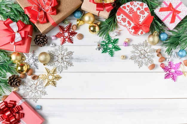 Christmas presents with decorations on white wooden