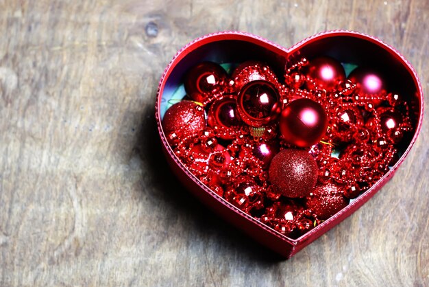 Christmas red ball in a box shape heart