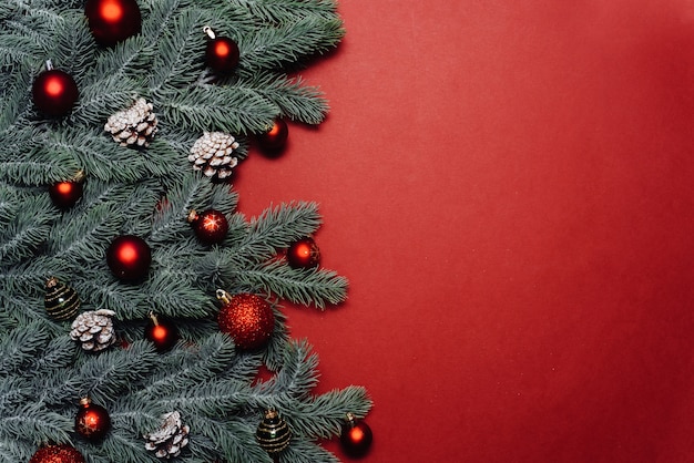 Christmas red decorations and fir tree branches