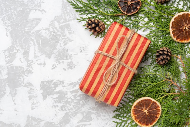 Christmas red eco gift on white cement background