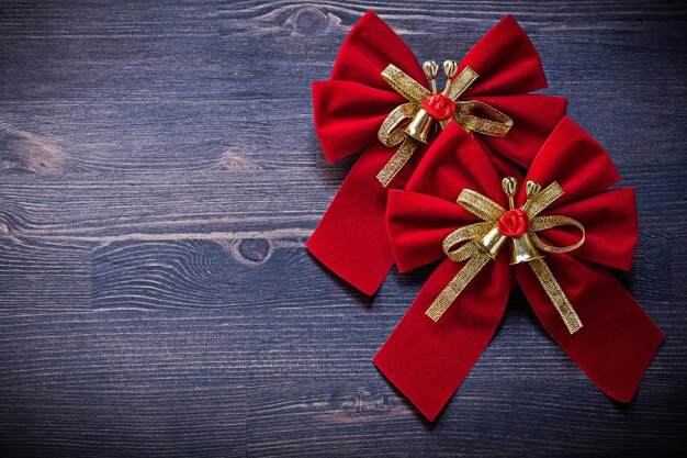 Christmas red knots on wooden board holidays concept