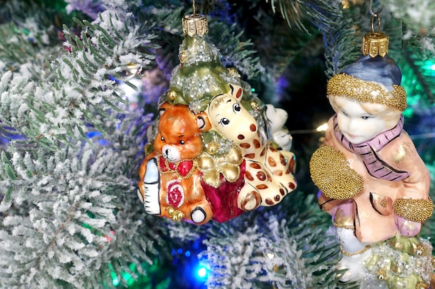 Christmas retro toy figurines on the tree closeup