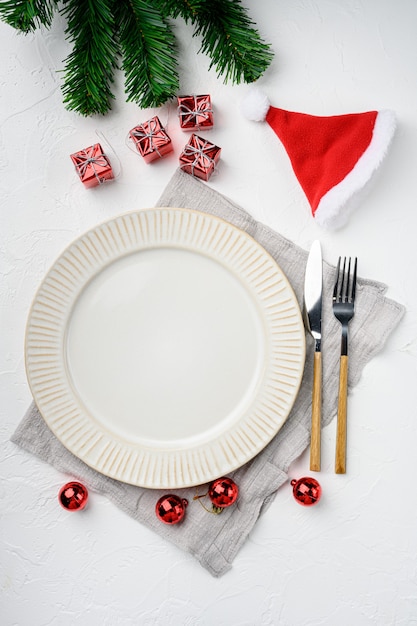 Christmas rustic home table setting with empty plate set, top view flat lay , with copy space for text or food, on white stone table background