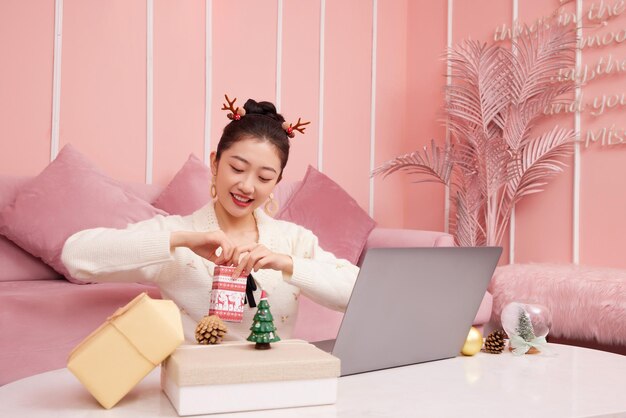 Christmas sale concept. beauty asian woman showing product christmas shoping online