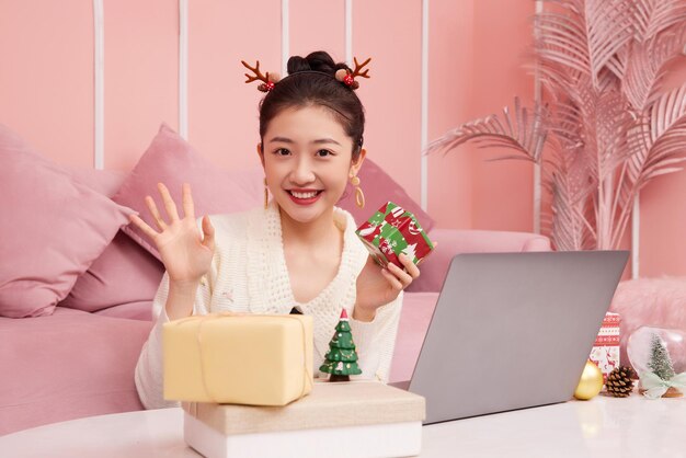 Christmas sale concept. beauty asian woman showing product christmas shoping online