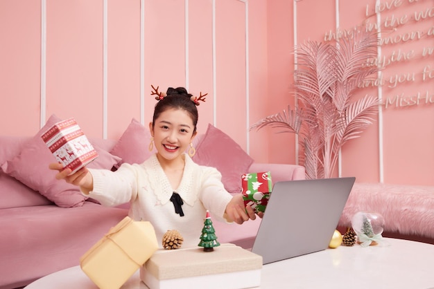 Christmas sale concept. beauty asian woman showing product christmas shoping online