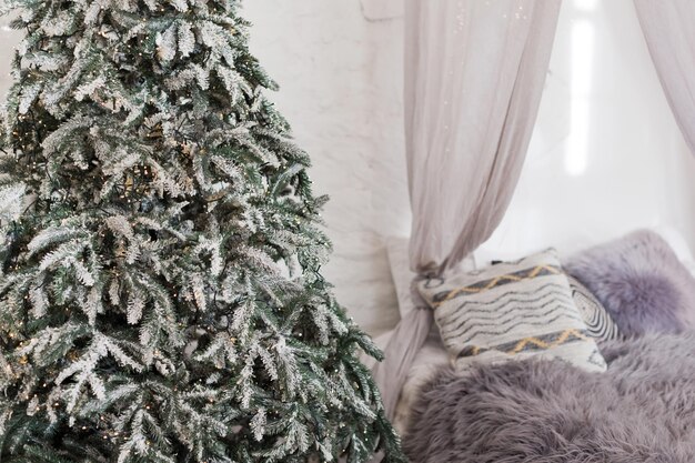 Christmas scandinavian bedroom with white canopy