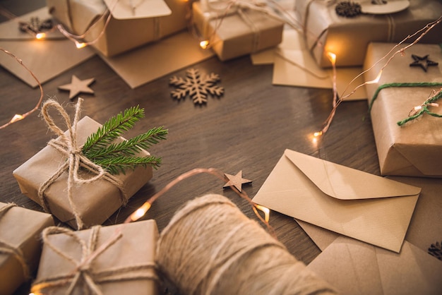 Christmas season Gift boxes with spruce branch on the rustic table