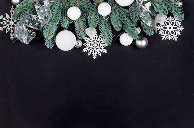 Christmas set with white balls and decorations on black