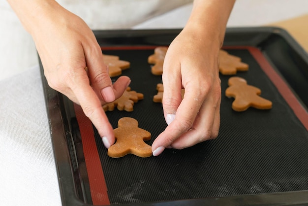 Christmas shortbread snowflakes Women's hands hold traditional New Year's gingerbread The concept of preparing for the New Year Christmas