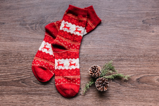 Christmas socks with small cones on table 