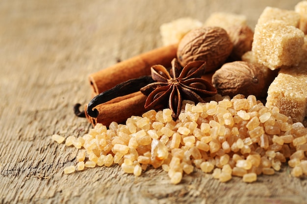 Christmas spices and baking ingredients on wooden background