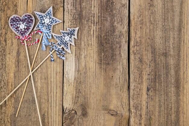  Christmas star, Christmas tree and heart on a background of wooden boards