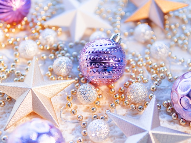 Christmas star decorations on white knitted background. 