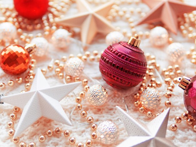 Photo christmas  star decorations on white knitted .