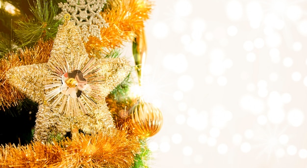 Christmas star and garlands on a tree