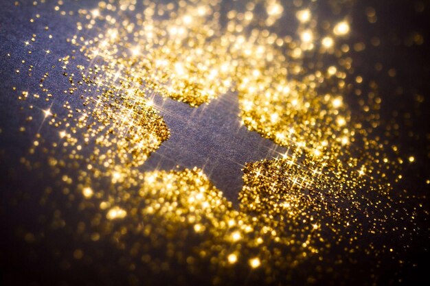 Photo christmas star golden glitter background