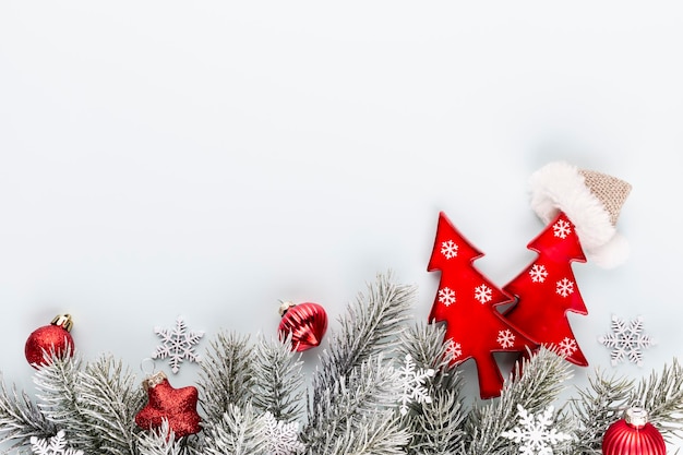 Christmas star and santa hat, decor on pastel blue background.