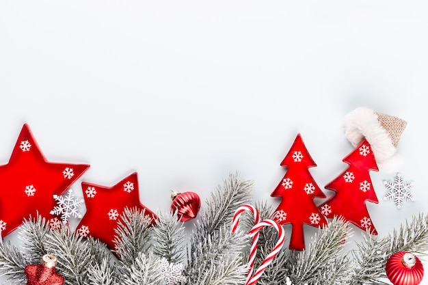 Christmas star and santa hat, decor on pastel blue background.