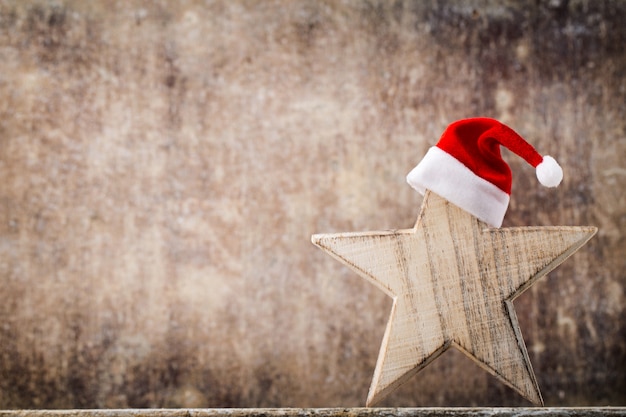 Christmas stars santa hat. Christmas pattern. Background on the gray color.