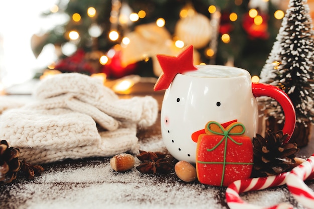 Christmas still life with cup of coffee, cookie and decorations. High quality photo