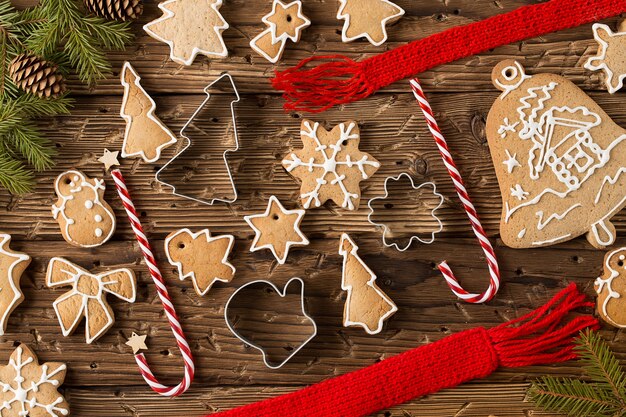 Christmas still life with traditional gingerbread cookies on woo