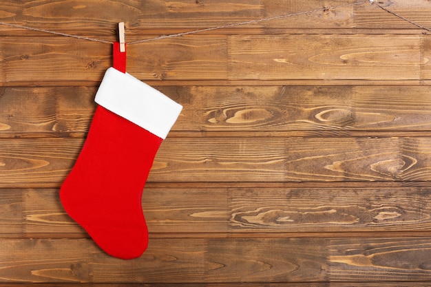 Christmas stocking hanging against wooden wall