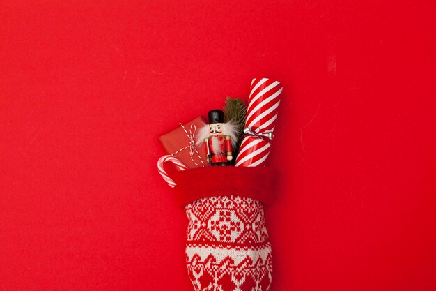 Christmas stocking with cracker toy and wrapped present