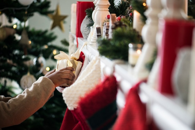 Christmas stockings are hanging by the chimney