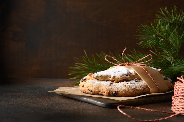 Christmas stollen - traditional German bread on brown.