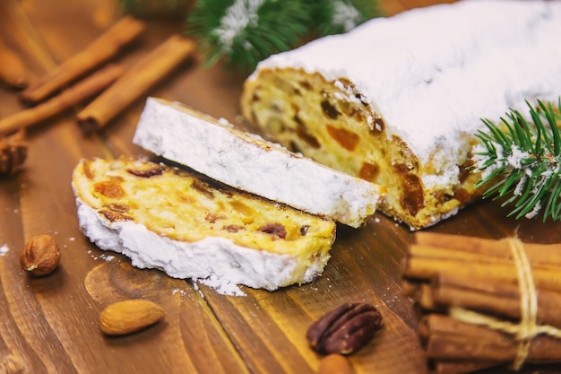 Christmas stollen on wooden background. selective focus.holoday