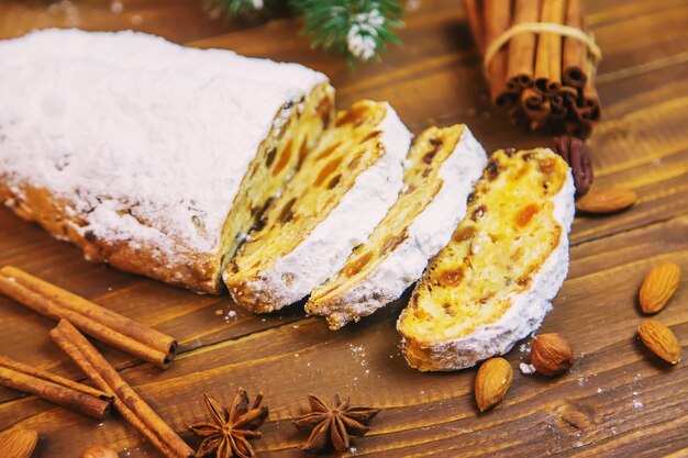 Christmas stollen on wooden background. selective focus.holoday