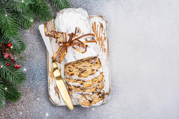 Christmas stollen on wooden board